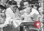 Image of chiropractors examining babies Los Angeles California USA, 1931, second 34 stock footage video 65675058948
