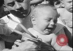 Image of chiropractors examining babies Los Angeles California USA, 1931, second 36 stock footage video 65675058948
