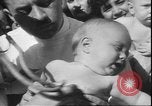Image of chiropractors examining babies Los Angeles California USA, 1931, second 38 stock footage video 65675058948