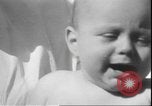 Image of chiropractors examining babies Los Angeles California USA, 1931, second 40 stock footage video 65675058948