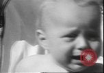Image of chiropractors examining babies Los Angeles California USA, 1931, second 42 stock footage video 65675058948