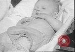 Image of chiropractors examining babies Los Angeles California USA, 1931, second 43 stock footage video 65675058948