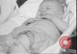 Image of chiropractors examining babies Los Angeles California USA, 1931, second 45 stock footage video 65675058948