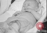 Image of chiropractors examining babies Los Angeles California USA, 1931, second 47 stock footage video 65675058948