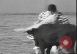 Image of Spanish comedians provoke bull Los Angeles California USA, 1935, second 39 stock footage video 65675058964