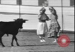 Image of Spanish comedians provoke bull Los Angeles California USA, 1935, second 57 stock footage video 65675058964