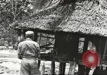 Standbild USA Soldaten New Guinea, 1944, aus Sekunde 15 historischem Filmmaterial Videoclip 65675059164