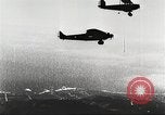 Image of C-2A aircraft midair refueling Los Angeles California USA, 1930, second 20 stock footage video 65675059524
