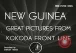 Standbild US Army Air Forces C-53 Flugzeuge drop liefert Kokoda New Guinea, 1942, aus Sekunde 4 historischem Filmmaterial Videoclip 65675059613