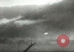 Standbild US Army Air Forces C-53 Flugzeuge drop liefert Kokoda New Guinea, 1942, aus Sekunde 44 historischem Filmmaterial Videoclip 65675059613