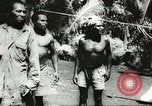 Standbild US Army Air Forces C-53 Flugzeuge drop liefert Kokoda New Guinea, 1942, aus Sekunde 57 historischem Filmmaterial Videoclip 65675059613