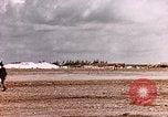 Image of 19th Fighter Squadron P-47 lands on captured airfield Saipan Northern Mariana Islands, 1944, second 32 stock footage video 65675059667