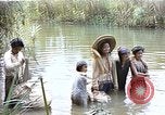 Image of Natives washing clothes in a river Leyte Philippines, 1945, second 1 stock footage video 65675059733