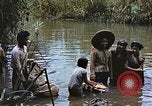 Image of Natives washing clothes in a river Leyte Philippines, 1945, second 4 stock footage video 65675059733