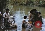 Image of Natives washing clothes in a river Leyte Philippines, 1945, second 5 stock footage video 65675059733