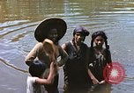 Image of Natives washing clothes in a river Leyte Philippines, 1945, second 7 stock footage video 65675059733