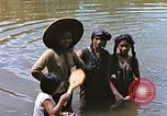 Image of Natives washing clothes in a river Leyte Philippines, 1945, second 8 stock footage video 65675059733
