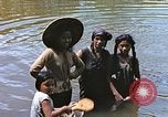 Image of Natives washing clothes in a river Leyte Philippines, 1945, second 9 stock footage video 65675059733