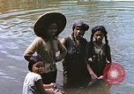 Image of Natives washing clothes in a river Leyte Philippines, 1945, second 10 stock footage video 65675059733
