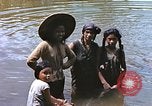 Image of Natives washing clothes in a river Leyte Philippines, 1945, second 11 stock footage video 65675059733