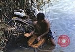 Image of Natives washing clothes in a river Leyte Philippines, 1945, second 14 stock footage video 65675059733
