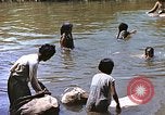 Image of Natives washing clothes in a river Leyte Philippines, 1945, second 22 stock footage video 65675059733