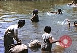 Image of Natives washing clothes in a river Leyte Philippines, 1945, second 23 stock footage video 65675059733