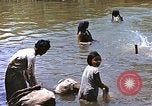 Image of Natives washing clothes in a river Leyte Philippines, 1945, second 25 stock footage video 65675059733