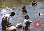 Image of Natives washing clothes in a river Leyte Philippines, 1945, second 26 stock footage video 65675059733