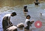 Image of Natives washing clothes in a river Leyte Philippines, 1945, second 27 stock footage video 65675059733