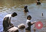 Image of Natives washing clothes in a river Leyte Philippines, 1945, second 28 stock footage video 65675059733