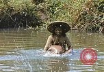 Image of Natives washing clothes in a river Leyte Philippines, 1945, second 30 stock footage video 65675059733