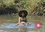 Image of Natives washing clothes in a river Leyte Philippines, 1945, second 31 stock footage video 65675059733