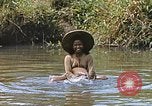 Image of Natives washing clothes in a river Leyte Philippines, 1945, second 32 stock footage video 65675059733