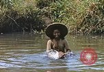 Image of Natives washing clothes in a river Leyte Philippines, 1945, second 33 stock footage video 65675059733