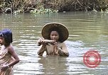 Image of Natives washing clothes in a river Leyte Philippines, 1945, second 36 stock footage video 65675059733