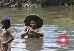 Image of Natives washing clothes in a river Leyte Philippines, 1945, second 37 stock footage video 65675059733
