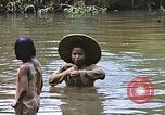 Image of Natives washing clothes in a river Leyte Philippines, 1945, second 38 stock footage video 65675059733