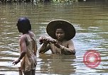 Image of Natives washing clothes in a river Leyte Philippines, 1945, second 39 stock footage video 65675059733