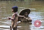 Image of Natives washing clothes in a river Leyte Philippines, 1945, second 40 stock footage video 65675059733