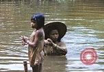 Image of Natives washing clothes in a river Leyte Philippines, 1945, second 41 stock footage video 65675059733