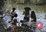 Image of Natives washing clothes in a river Leyte Philippines, 1945, second 43 stock footage video 65675059733