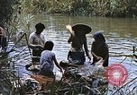Image of Natives washing clothes in a river Leyte Philippines, 1945, second 44 stock footage video 65675059733