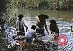 Image of Natives washing clothes in a river Leyte Philippines, 1945, second 45 stock footage video 65675059733