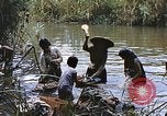 Image of Natives washing clothes in a river Leyte Philippines, 1945, second 48 stock footage video 65675059733