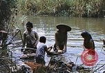 Image of Natives washing clothes in a river Leyte Philippines, 1945, second 49 stock footage video 65675059733