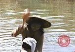 Image of Natives washing clothes in a river Leyte Philippines, 1945, second 53 stock footage video 65675059733