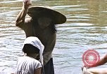 Image of Natives washing clothes in a river Leyte Philippines, 1945, second 54 stock footage video 65675059733