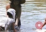 Image of Natives washing clothes in a river Leyte Philippines, 1945, second 55 stock footage video 65675059733