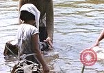 Image of Natives washing clothes in a river Leyte Philippines, 1945, second 56 stock footage video 65675059733